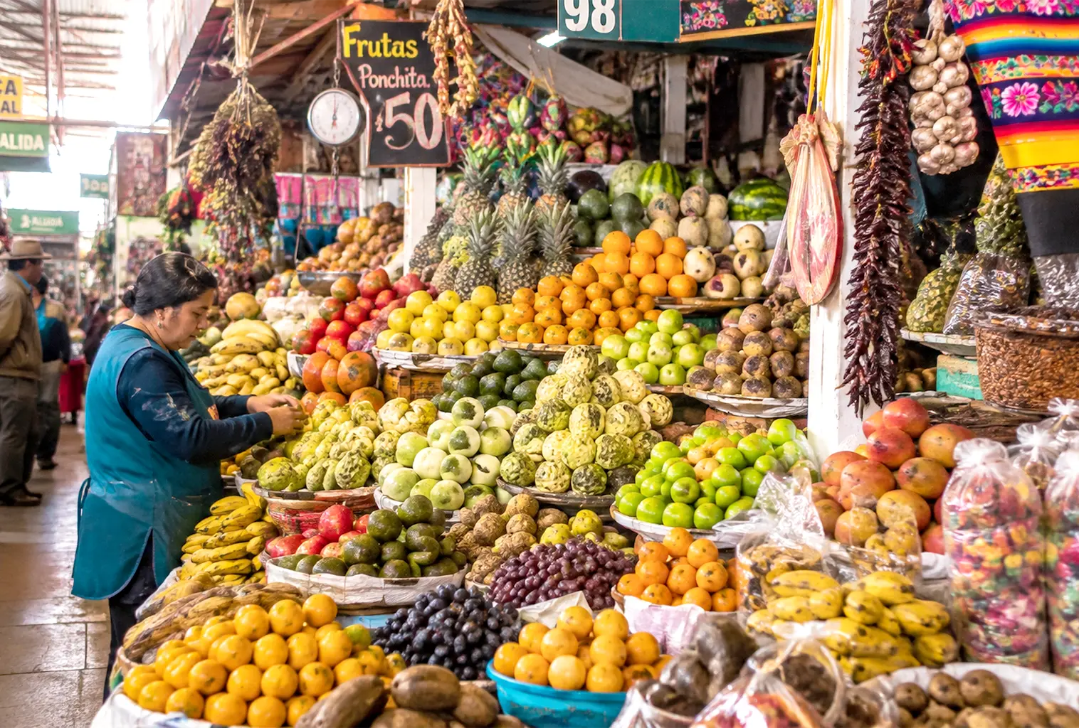 A vibrant local Peruvian market stall filled with fresh citrus, passion fruit, avocados, and exotic Andean produce.